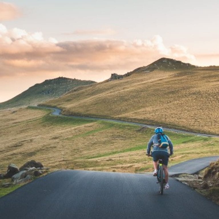 Person biking through the mountains